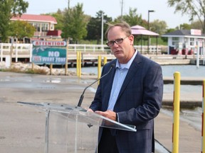 Rob Thompson, a vice-president at Nova Chemicals, speaks Wednesday at Sarnia Bay. Nova is providing $200,000 to the Great Lakes Plastic Cleanup Initiative.