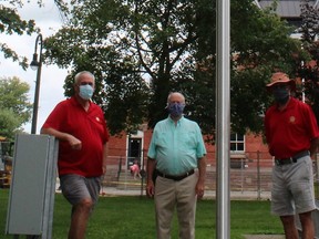 Rotarian Mark Braet, left, Mayor R. Brad Loosley, centre, and Rotarian Steve Anema, right, stand beside the new flagpole in Victoria Park, donated by the Rotary Club of Petrolia. 
Handout/Sarnia This Week