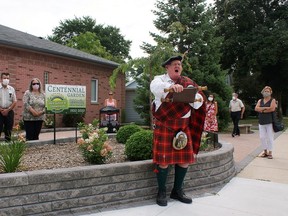 Town Cryer David Phillips gives an address in August to help celebrate 100 years of the West Lorne & Community Horticultural Society. The event also included the unveiling of the Grand Centennial Raised Display Bed at the corner of Graham Street and Main Street. (Handout/Postmedia Network)