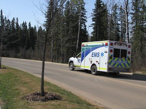 An ambulance drives towards the Anzac Recreation Centre in Anzac Alta. on Wednesday May 4, 2016. Robert Murray/Fort McMurray Today/Postmedia Network