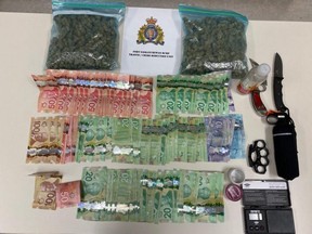 Investigators said they found one pound of marijuana, four grams of methamphetamine and 28 ml of Gamma-Hydroxybutyrate (GHB). There were also a number of weapons found including bear spray, brass knuckles and knives. RCMP said the search also turned up a digital scale, stolen credit cards and 3,385 in Canadian currency suspected of being the proceeds of crime. Photo Supplied