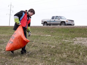 Joey Hooper, 14,  picks up trash along Highway 627 near Range Road 262 west of Edmonton, Alberta on Saturday, May 5, 2012. Hooper was out with his Christian youth group Young Life fundraising to attend RockRidge, a summer camp near Princeton, BC.