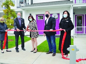 City officials, provincial representatives and members of the LRHF celebrated the official opening of Phase 2 of the Linsford Gardens Housing project. (Lisa Berg)