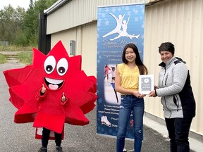 Alicia Gallagher, 13, accepts the Eva Thompson Award from Coach Nadia Riopel and club mascot Pixel during an evening celebrating the Timmins Porcupine Figure Skating Club’s 2019-20 season recently at the Archie Dillon Sportsplex. SUBMITTED PHOTO