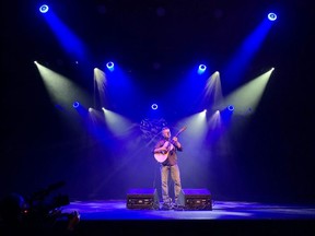 As Festival Place staff flexed their talents with the new light and sound system, Edmonton's Mark Sterling was the first artist to grace the Festival Place main stage in about six months during a special media event on Friday, Sept. 18. Lindsay Morey/News Staff