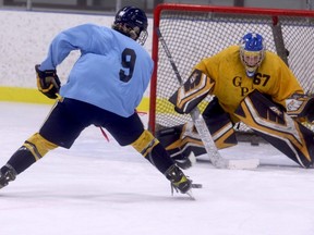 GPAC U16 AAA Storm forward Austin Boyd (#9) goes in alone on goaltender Nathan Crawley during practice at the Coca-Cola Centre on Friday morning. U16 Head Coach Brett Stephenson and assistant Ben Radke seem pleased with the club they selected two weeks ago.