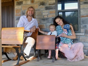 Yuri and Jennifer Pool are building a one-room schoolhouse on their St. Williams farm to offer homeschooling to children. With them is their three-year-old daughter Finna, who will be a student in the schoolhouse, and five-month-old son Sutton. (ASHLEY TAYLOR)