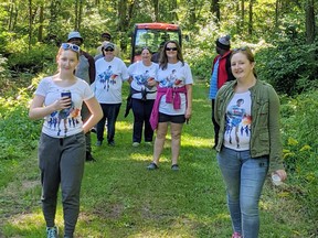 Members of the Norfolk Terry Fox Run committee, including chair Jenn Kaczynski (centre), Maddy Thorpe (left) and Mackenzie Thorpe (right) enjoy a five-kilometre walk on Sunday. Contributed  Photo