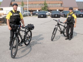 Chatham-Kent Police Service Constables Chris Reynolds (left) and Kim Pfaff are among the local officers trained to serve on the new Bicycle Patrol Unit, approved during the Sept. 15 police services board meeting. Ellwood Shreve/Postmedia Network