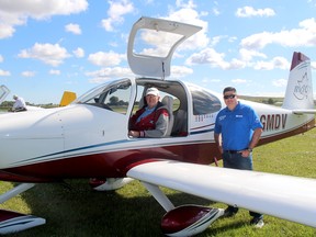 The Canadian Owners and Pilots Association - Chatham Chapter held a fly-in in for members of Trillium Aviators Ontario on Saturday at the Chatham-Kent Municipal Airport. Guelph resident Ivan Kristensen, in pilot's seat, a founder of the Trillium Aviators Ontario is seen here being welcomed by Aaron McPhail, vice-president of the local COPA chapter. Ellwood Shreve/Postmedia Network