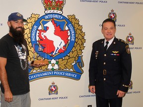 Kevin Moore (left) of Chatham received a Chatham-Kent Police Services Board Citation from Chief Gary Conn during the Sept. 15 board meeting for his efforts to save a man who was in distress. Ellwood Shreve/Postmedia Network