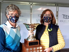 The Bridges at Tillsonburg ladies league golf champion Mary Delouche accepts the nine-hole trophy sponsored by Verne's Carpet One from nine-hole captain Catherine Burke. (Contributed photo)