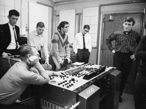 Cliff Richard (aka Harry Webb) in a stylish sweater, listens as the producer and recording technician makes some adjustments in a recording studio of EMI in London, in this photo from Nov. 19, 1962. Second from right is Hank Marvin (aka Brian Rankin) and on the right in striped shirt, Bruce Welch, both of the backing group the Shadows. Getty Images