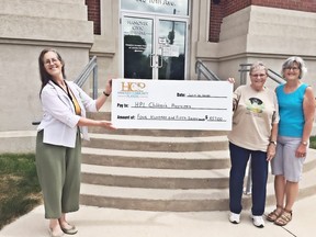 In this file photo, the Hanover Community Players donated $457, the proceeds from their $1 per adult ticket program, raised through their first panto, Sleeping Beauty. The money is earmarked for children’s programming at the Hanover Public Library. Taking part in the cheque presentation are, from left, chief librarian Agnes Rivers-Moore and Marg Poste and Dianne Mather of the Hanover Community Players. The library is closed, however, the library is continuing to provide service by curbside pickup.