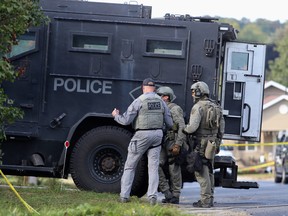 Ontario Provincial Police work with Kingston Police during an incident on Ford Street in Kingston on Sept. 23, 2020.