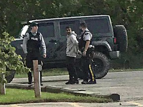 The man being arrested outside of the Days Inn Hotel in Portage la Prairie. (Supplied photo)