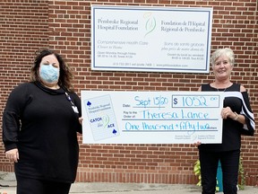 Leigh Costello (left), Pembroke Regional Hospital Foundation community fundraising specialist, presents a cheque for $1.052 to Theresa Lance, winner of the Week 9 prize in the foundations online Catch the Ace lottery.
