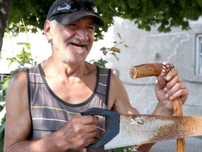Joe Maione and one of his walking sticks on James Street in Sault Ste. Marie, Ont., on Wednesday, Sept. 23, 2020. (BRIAN KELLY/THE SAULT STAR/POSTMEDIA NETWORK)