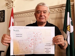 Dennis Travale, chair of Norfolk’s Police Services Board, with a map of Norfolk County with suspected illegal cannabis grow operations highlighted in red. Norfolk’s PSB will invite federal health minister Patty Hadju to explain what Health Canada is doing to monitor and control the proliferation of illegal, disruptive marijuana grow-operations in Norfolk County, now believed to number 70 in total. – Monte Sonnenberg