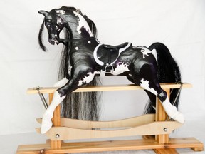 Hand-carved and painted gliding rocking horse crafted by Laurie Wedler