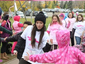 Candace Temple with the Original Joe’s team gets high fives from the Gymniks All-Stars cheer team as she crosses the finish line in the CIBC Run for the Cure breast cancer fundraiser at Muskoseepi Park back in 2017. This year’s event will take place on Oct. 4 in Grande Prairie.