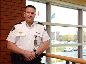 Supt. Sean Curry, officer in charge of the Grande Prairie RCMP detachment, leans against a railing inside the detachment in Grande Prairie, Alta. on Thursday, Sept. 24, 2020.
