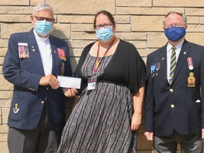 Bryan Robertson and Dan Reilly from Branch 79 of the Royal Canadian Legion presented a cheque for $10,000 to Jennifer White, director of development at Norfolk General Hospital. The money, raised during the 2019 poppy campaign, will go towards the purchase of a new eye laser, which is expected to cost over $104,000. (ASHLEY TAYLOR)