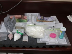 This photo provided by Lambton OPP shows Items allegedly seized during search in Watford.