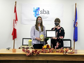 Sexsmith Secondary School Assistant Principal Jennifer Thompson (right) presented PWPSD's Edwin Parr Teacher Award to Nicole Cooper (left).