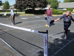 Anne Boyd, right, tried pickleball in Tillsonburg Saturday afternoon at Hickory Hills. (Chris Abbott/Norfolk Tillsonburg News)