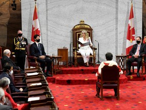 Chief of Defence Staff Jonathan Vance, Prime Minister Justin Trudeau, Senator Marc Gold, and RCMP Commissioner Brenda Lucki listen as Canada's Governor General Julie Payette delivers the throne speech in the Senate chamber in Ottawa, Ontario, Canada September 23.  Adrian Wyld/Pool via REUTERS. ORG XMIT: SKP130