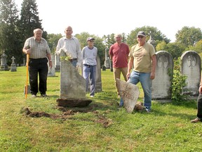 The ongoing work of repairing heritage grave markers in Chatham-Kent continues thanks to volunteers with the Chatham-Kent Cemetery Restoration Project. From left are volunteers Les Mancell, Bruce Warwick, Peggy O'Rourke, Tom Moore, Tom Mallard and Collin Mardling, supervisor of Chatham-Kent cemeteries. Restoration work took place at Maple Leaf Cemetery in Chatham on Sept. 22. Ellwood Shreve/Postmedia Network