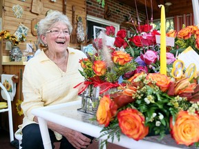 Bereavement companion Dixie Peters celebrates her 80th birthday with 80 roses from her clients in Morpeth on Sept. 25. Mark Malone/Postmedia Network