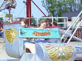 The Chatham-Kent Museum will be reopening Sept. 30 with the return of the Carnivals! Festivals! Fairs! Oh My! exhibit. In this photo from the museum's George James collection, two people are enjoying the Scrambler at the Jaycee Fair. (Handout/Postmedia Network)