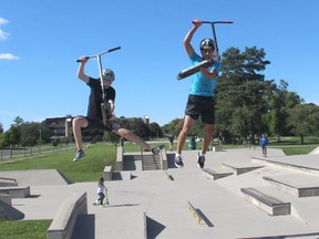 Gavin Hegmans (left) and Lucas Eddington are forward to being host to the second annual CK Scooter Festival, being held at the Chatham Skate Park on Oct. 3. They were showing off some of their moves on Sept. 19. Ellwood Shreve/Postmedia Network