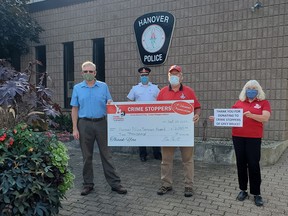 Pictured left to right is Hanover Police Services Board Chair – Don Smith, Chief of Police Chris Knoll, CrimeStoppers Board of Directors Representatives Marty Fitz and Margaret Visser.