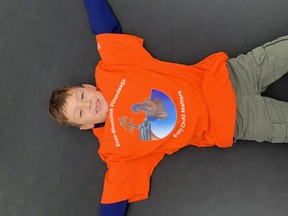 Taylor Brunet, 6, shows off his orange t-shirt as part of Orange Shirt Day, Wednesday.

Submitted Photo