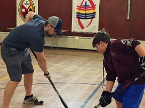Mentor with Big Brothers Big Sisters Cody Buhler playing some floor hockey with his match Liam. (supplied photo)