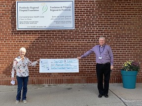 Pembroke Regional Hospital Foundation Executive Director Roger Martin presents Catch the Ace progressive jackpot raffle week number 10 winner Marian Bark with her cheque. Submitted photo