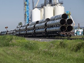 Large diameter pipe sits on rail cars on a siding in Dimsdale, Alta. on June 18, 2020. Randy Vanderveen/Postmedia Network
