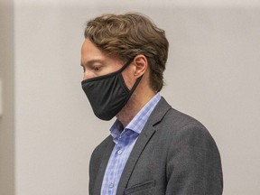 Dr. Chris Mackie, the medical officer of health for London-Middlesex, is seen addressing London city council in this July file photo. Derek Ruttan/Postmedia Network