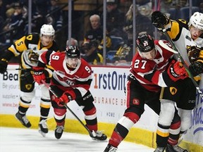 Photo provided
Ottawa defenceman Jack Matier (No. 27) battles for possession with Hamilton's Jan Jenik in 2019 OHL action