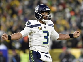 Russell Wilson of the Seattle Seahawks reacts as they take on the Green Bay Packers in the third quarter of the NFC Divisional Playoff game at Lambeau Field on Jan. 12, 2020 in Green Bay, Wisconsin.