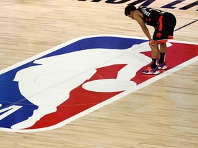 Kyle Lowry of the Raptors catches his breath during double overtime against the Boston Celtics on Wednesday night.