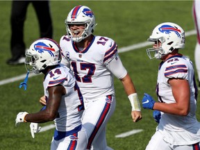 Stefon Diggs #14, Josh Allen #17, and Tyler Kroft #81, all of the Buffalo Bills, celebrate after scoring a touchdown during the third quarter against the Los Angeles Rams at Bills Stadium on September 27, 2020 in Orchard Park, New York.