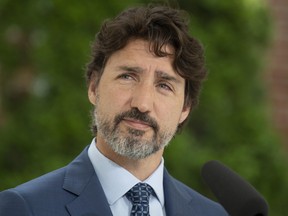 Prime Minister Justin Trudeau listens to a question during a news conference outside Rideau Cottage in Ottawa, Monday June 22, 2020. THE CANADIAN PRESS/Adrian Wyld