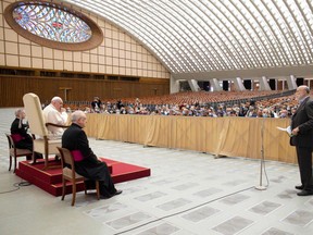 This photo taken and handout on September 12, 2020 by the Vatican Media shows Pope Francis (2ndL), flanked by Monsignor Leonardo Sapienza (Front L), and Monsignor Luis Maria Rodrigo Ewart (Rear L), holding a meeting with the "Laudato si'" community at Paul-VI hall in The Vatican. - 'Laudato si'' (Praise Be to You!), dated May 24 2015, is the second encyclical of Pope Francis. (Photo by Handout / VATICAN MEDIA / AFP)