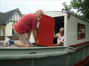 CWHC volunteers Hank Vanderschans and Dianne Bray repair the historic Ancaster outside of the organization's marine and rail museum in Owen Sound. SUPPLIED