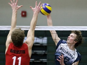 Chatham Ballhawks' Trevor Everitt (12) hits against Luke Zettel of the Bluewater Ballistix during a quarter-final in the 18U McGregor Cup Championship 'A' volleyball tournament at St. Clair College's Thames Campus HealthPlex in Chatham, Ont., on Saturday, Jan. 30, 2016. Mark Malone/Chatham Daily News/Postmedia Network