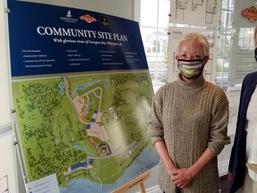 Sales rep Sharon Johnston and Rob McLeese, a founder of the Cobble Beach golf restort community, in the real estate centre Saturday, Sept. 12, 2020 in Georgian Bluffs. (Scott Dunn/The Sun Times/Postmedia Network)